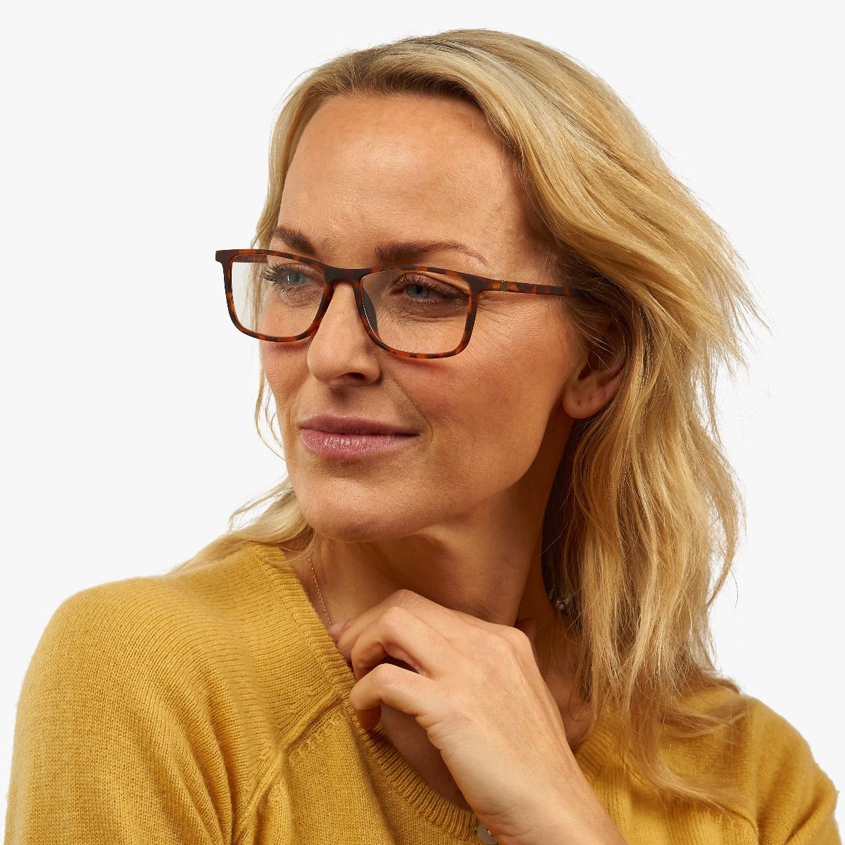 Person wearing Skagen Turtle tortoise reading glasses